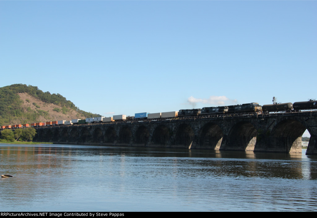 NS 4020 takes train 21M over Rockville bridge alongside train 12R